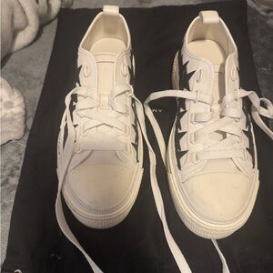 White Sneakers with Black Star Accents